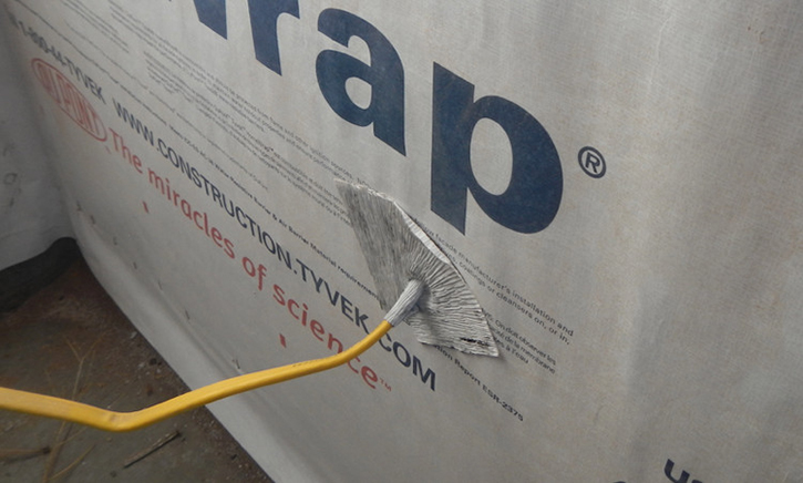 Flashing Panel with Housewrap Tape Above Conduit/Pipe Overlapping Housewrap with Flex Tape Around the Top